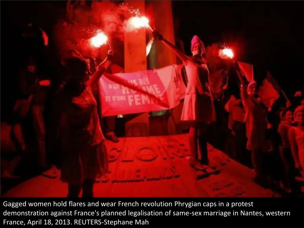 gagged women hold flares and wear french n.